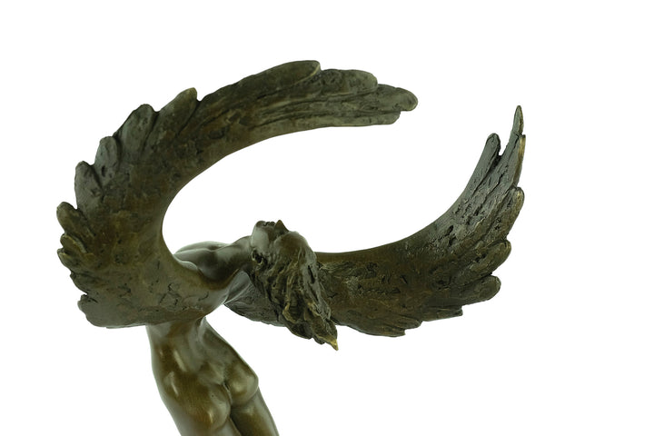 Bronze sculpture of a winged female in rising motion