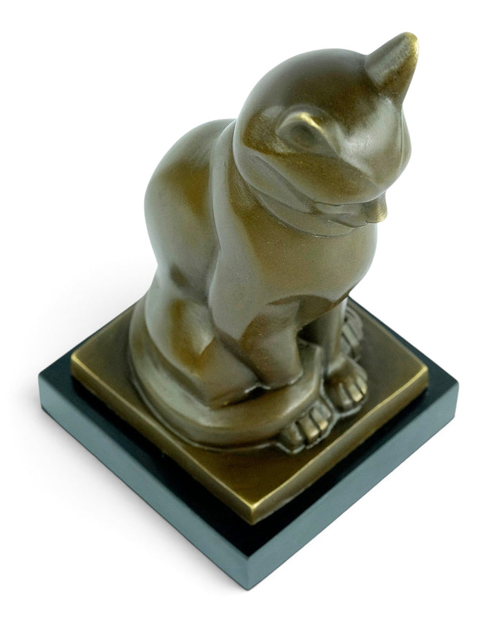Bronze sculpture of a sitting cat in cubist style