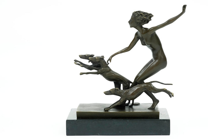 Bronze sculpture of a female running with three dogs
