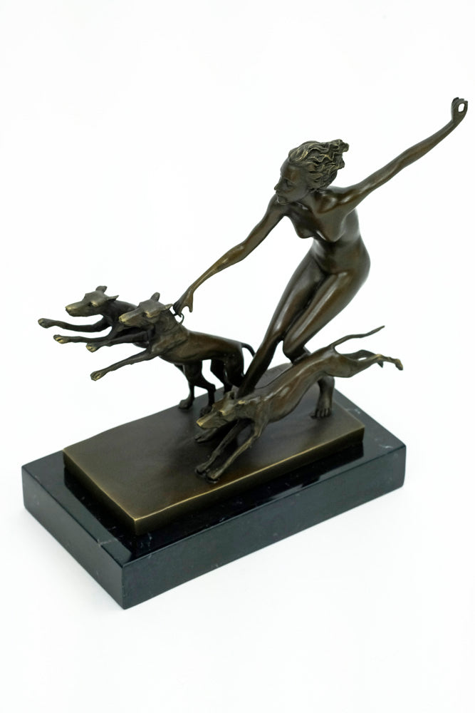 Bronze sculpture of a female running with three dogs