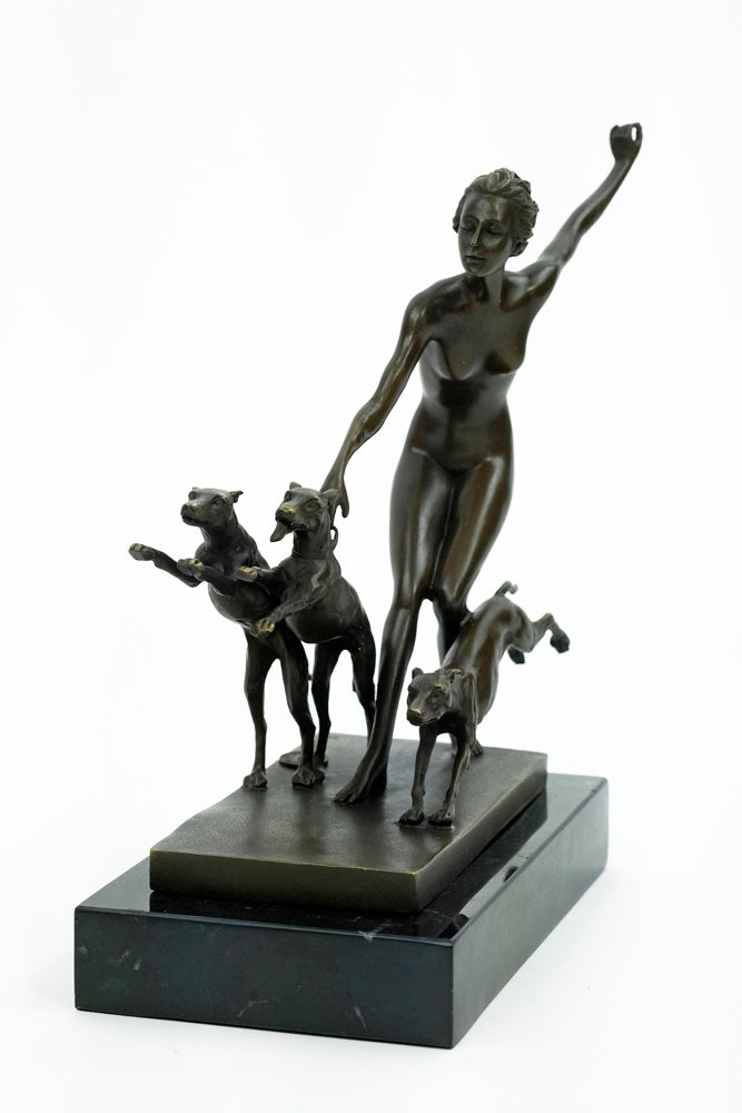 Bronze sculpture of a female running with three dogs