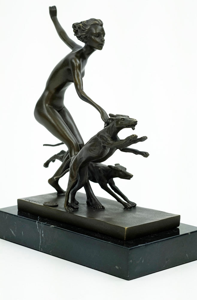Bronze sculpture of a female running with three dogs