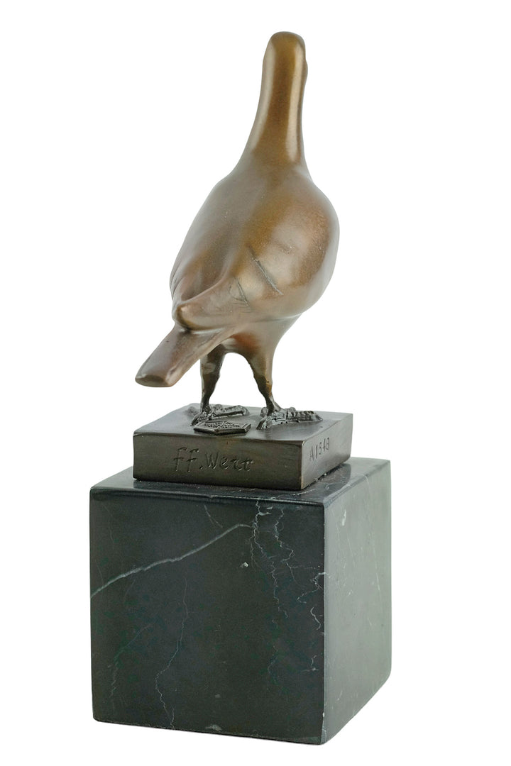 Bronze sculpture of a standing pigeon