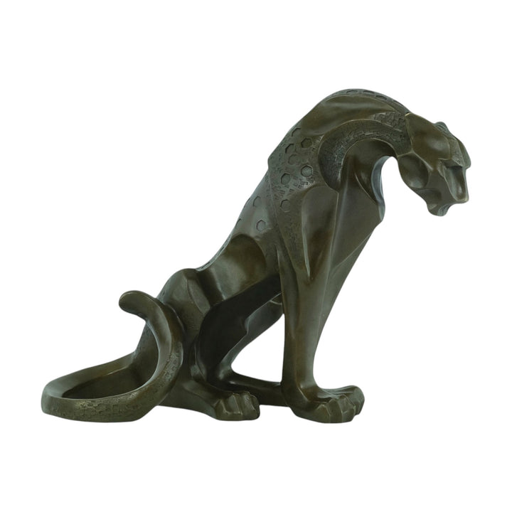 Bronze sculpture of a sitting jaguar in cubist style