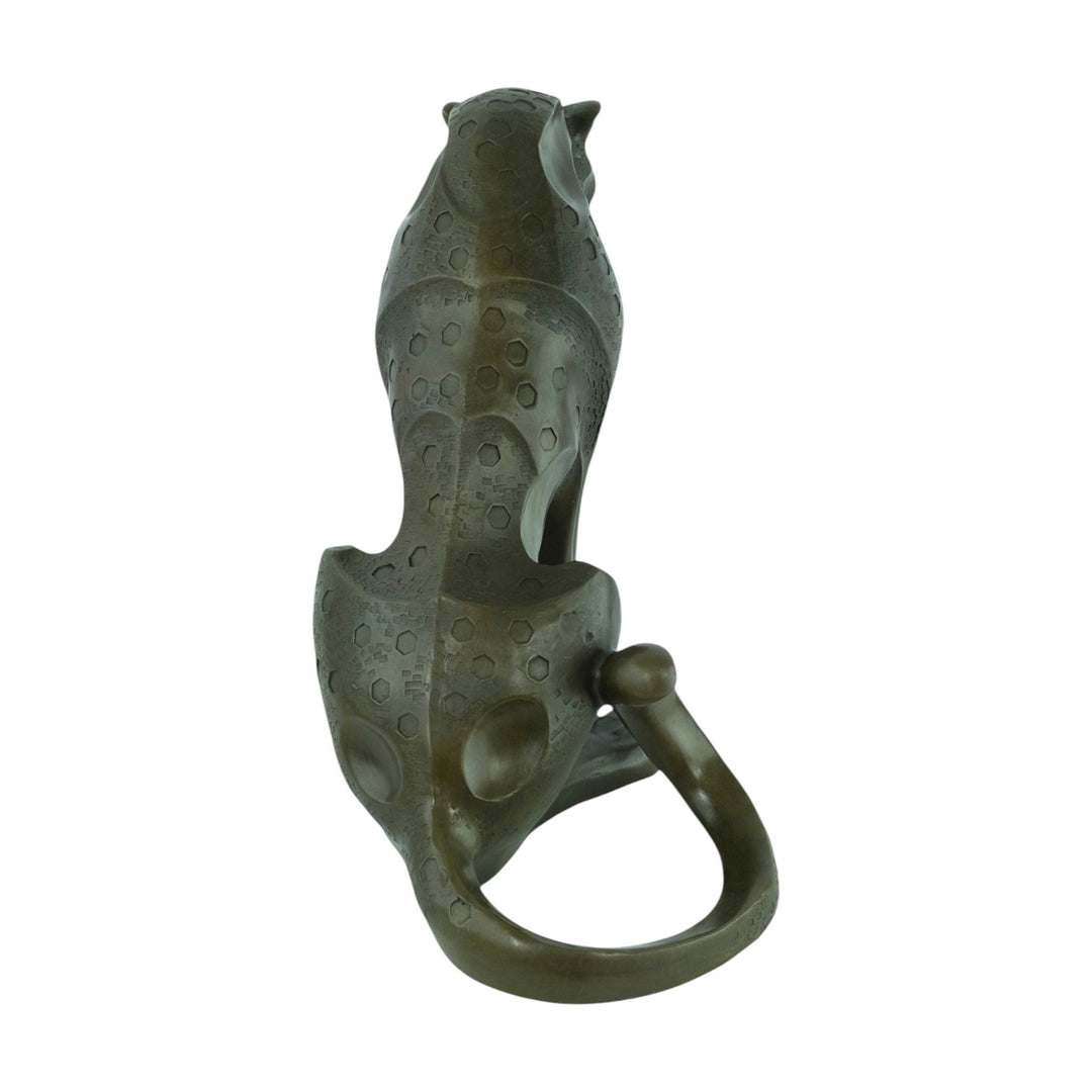 Bronze sculpture of a sitting jaguar in cubist style