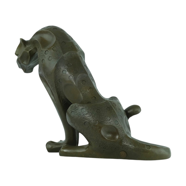 Bronze sculpture of a sitting jaguar in cubist style