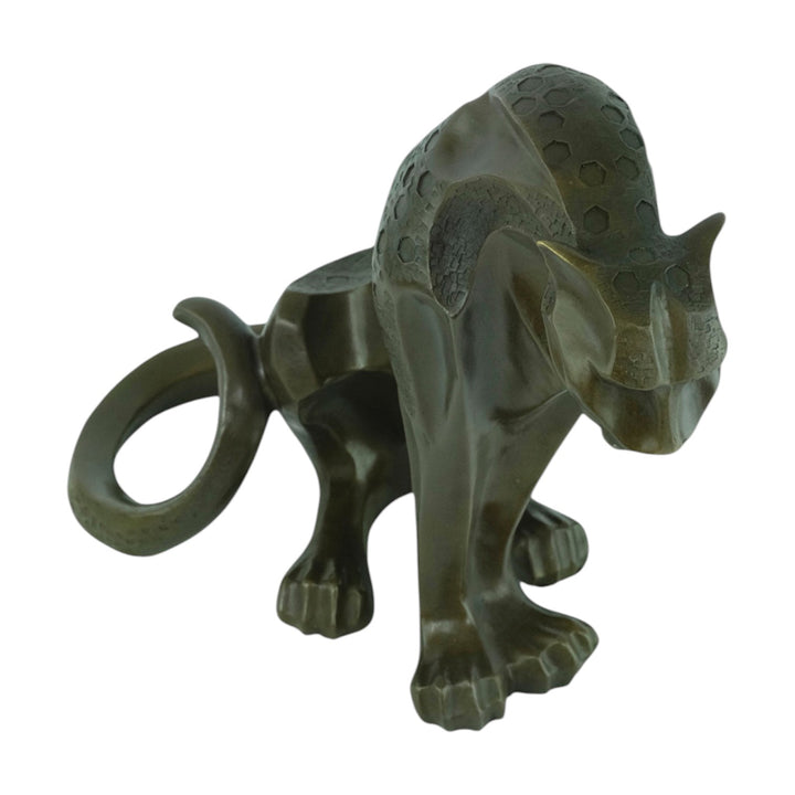 Bronze sculpture of a sitting jaguar in cubist style