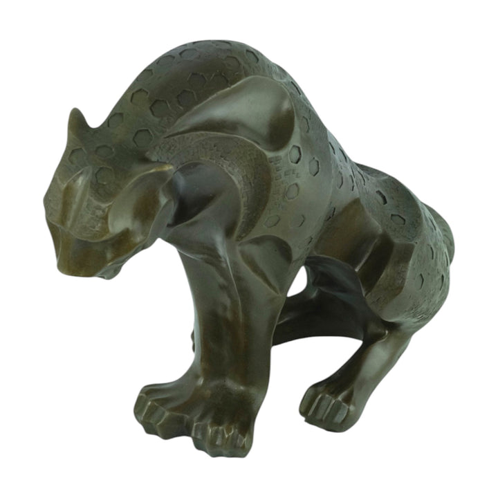 Bronze sculpture of a sitting jaguar in cubist style