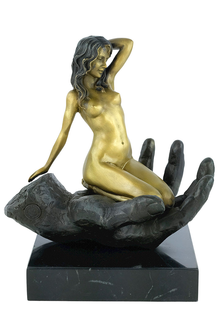 Modern bronze sculpture of a female sitting in a hand