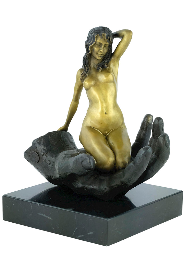 Modern bronze sculpture of a female sitting in a hand