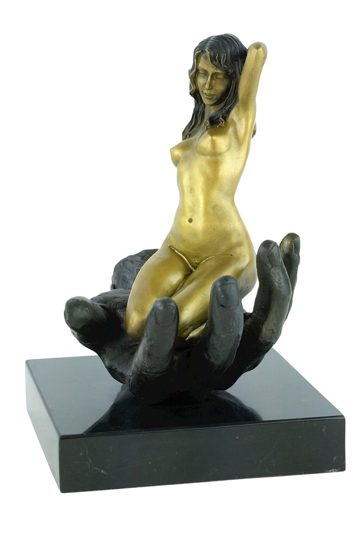 Modern bronze sculpture of a female sitting in a hand