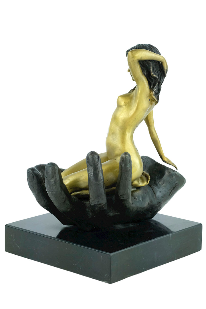 Modern bronze sculpture of a female sitting in a hand