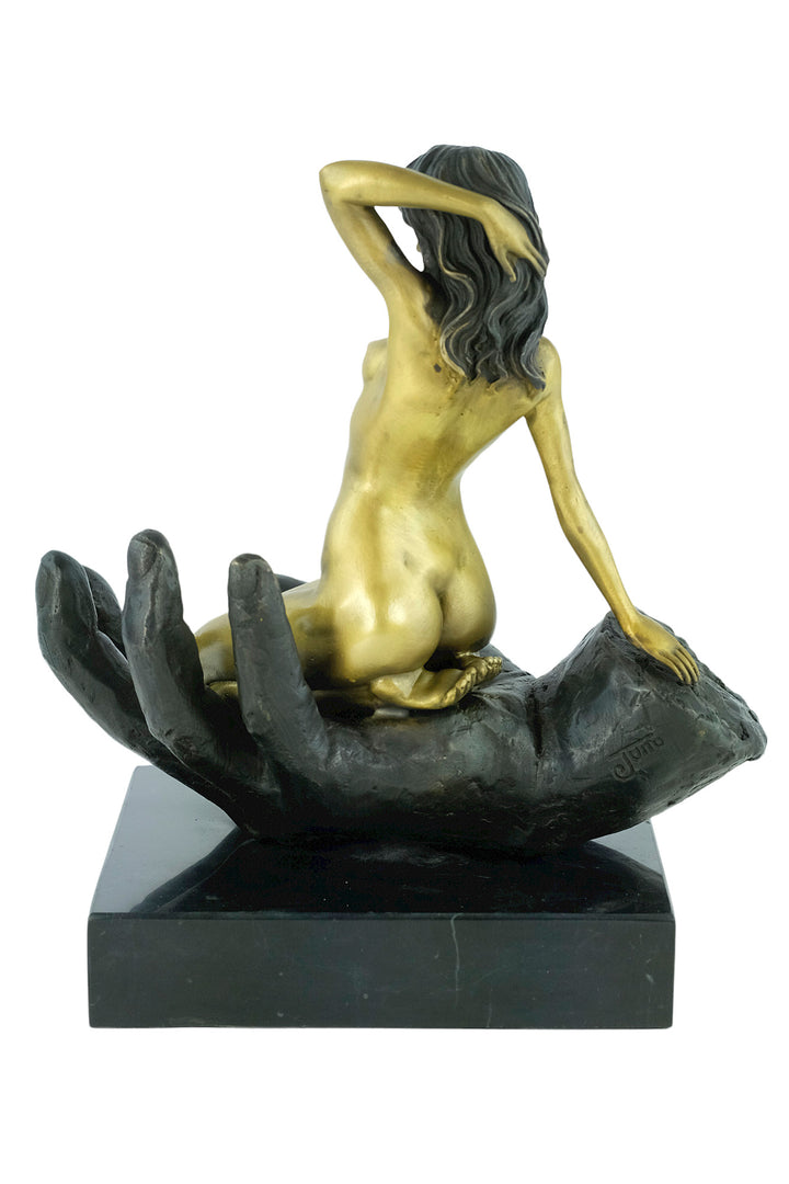 Modern bronze sculpture of a female sitting in a hand
