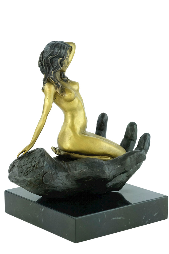 Modern bronze sculpture of a female sitting in a hand