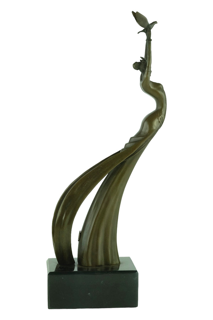 Modern bronze sculpture of a female releasing a bird