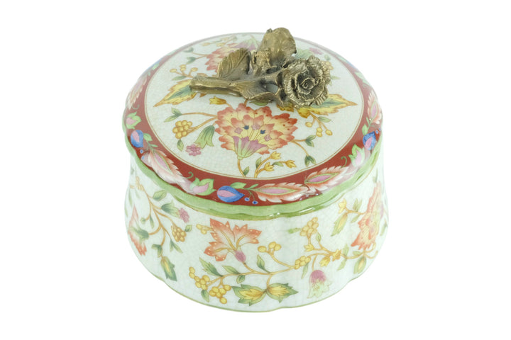 Porcelain box with floral decoration and a bronze rose on the lid