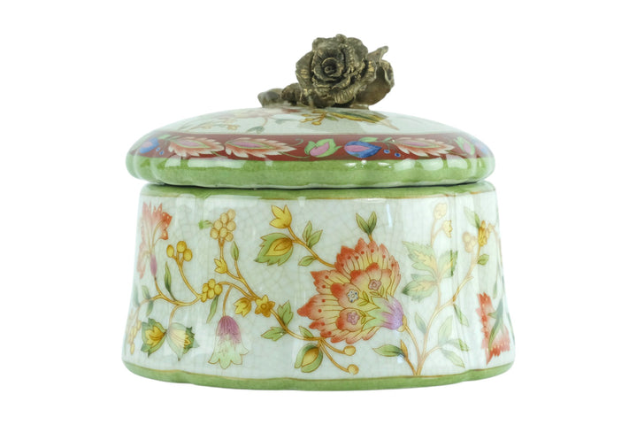 Porcelain box with floral decoration and a bronze rose on the lid