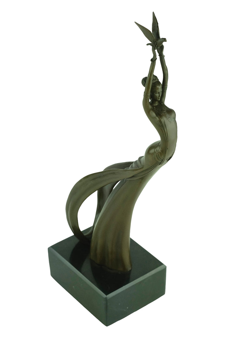 Modern bronze sculpture of a female releasing a bird