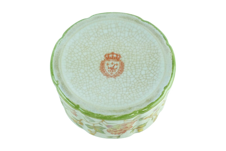 Porcelain box with floral decoration and a bronze rose on the lid