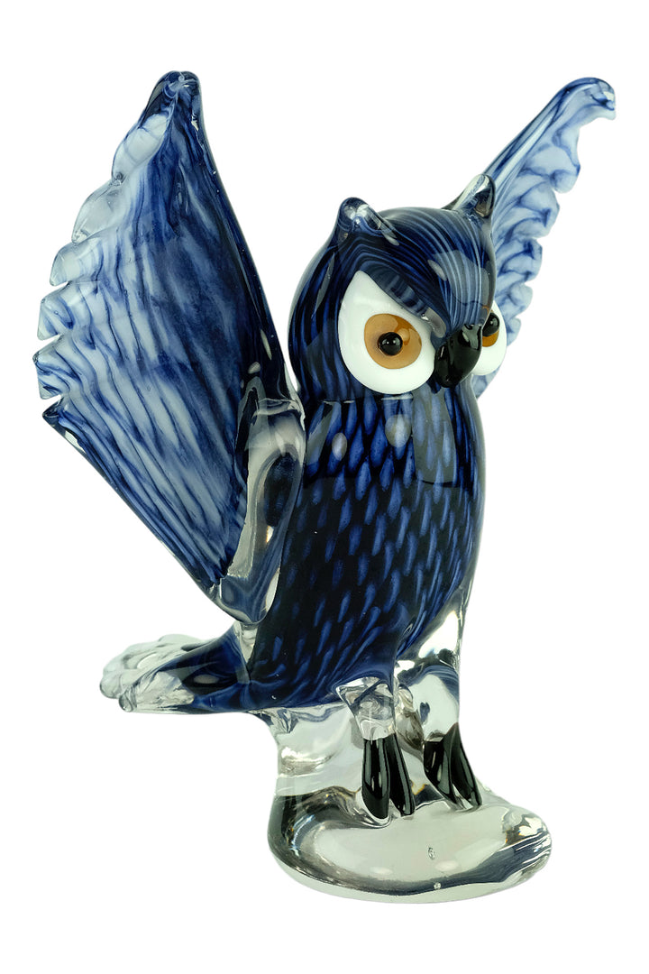 Colourful glass sculpture of an owl with wings spread