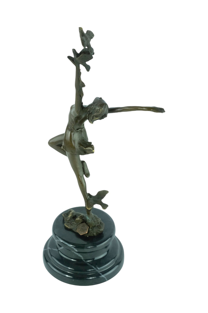 Bronze sculpture of a female dancing with birds