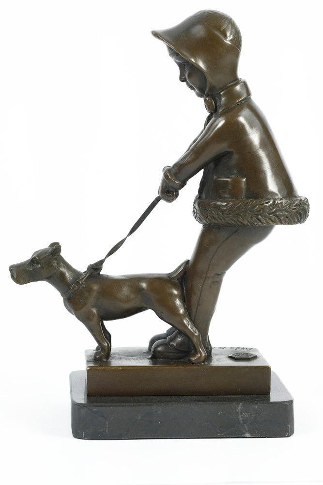 Bronze sculpture of a young girl walking her dog