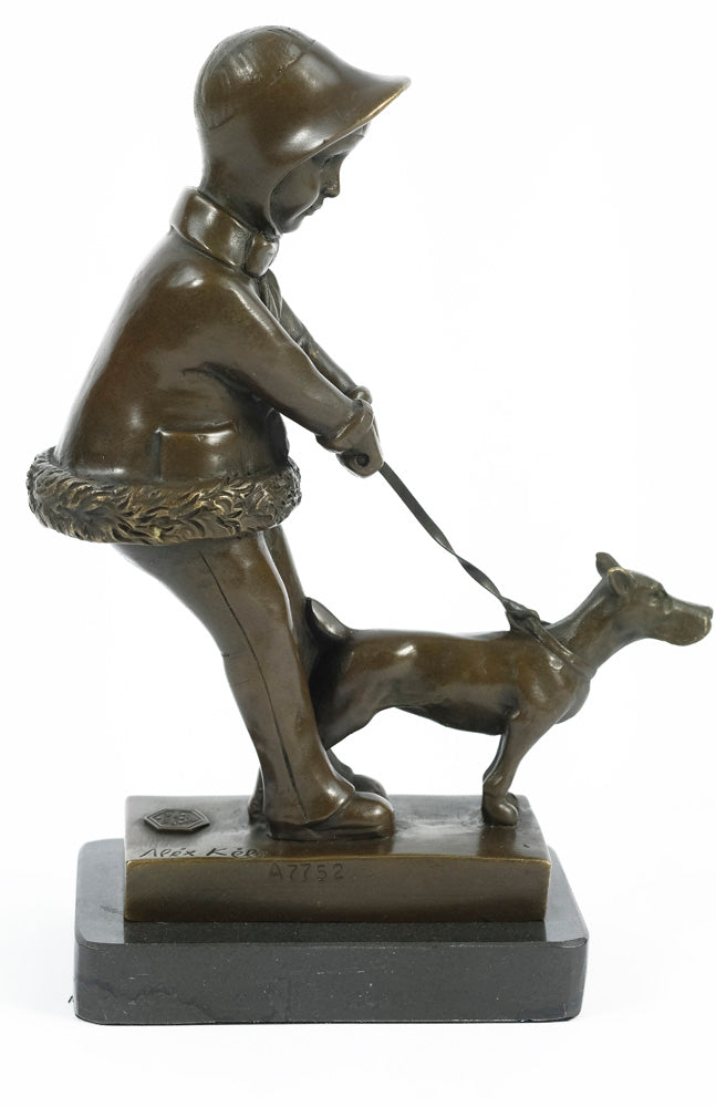 Bronze sculpture of a young girl walking her dog