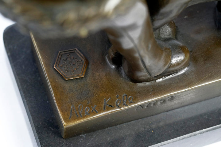 Bronze sculpture of a young girl walking her dog
