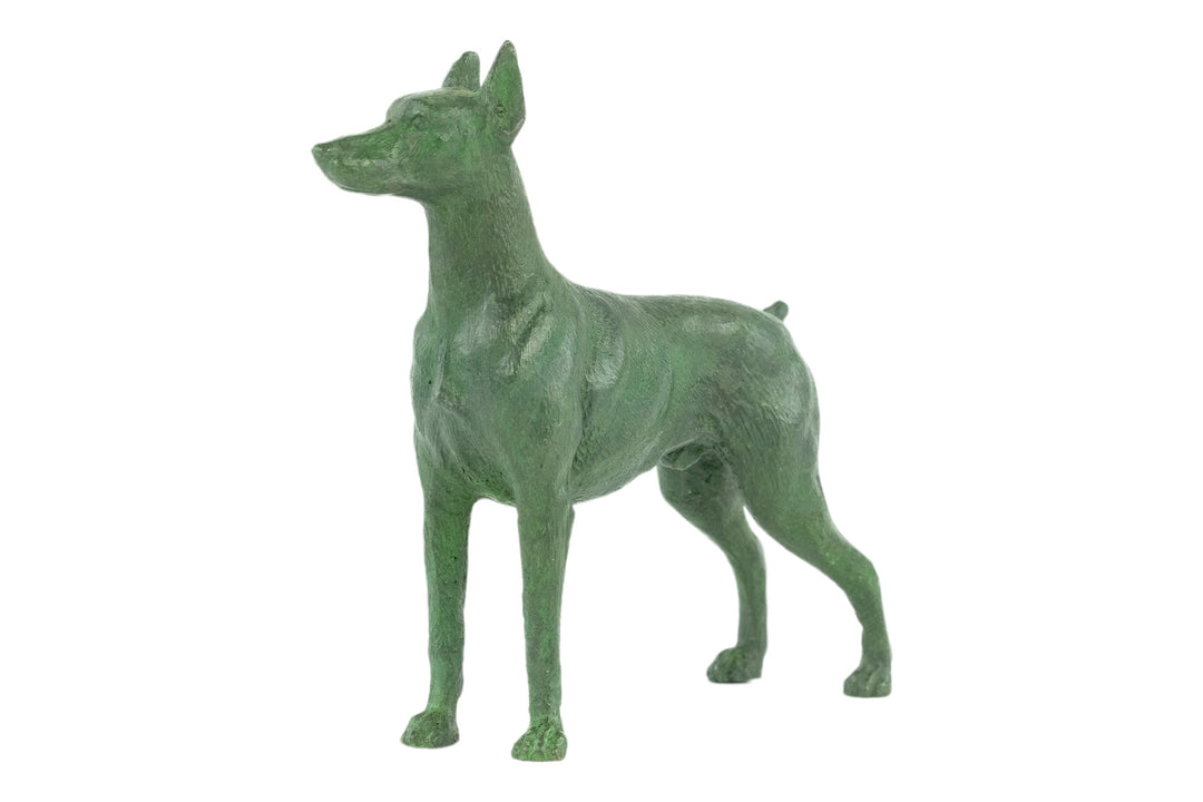 Bronze sculpture of a standing dobermann dog