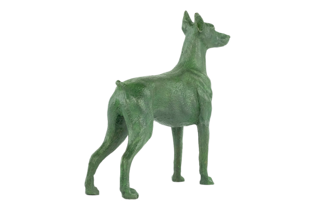 Bronze sculpture of a standing dobermann dog