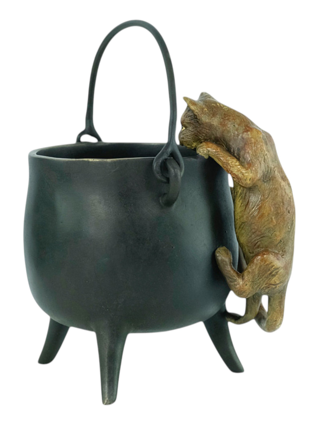 Bronze sculpture of a curious cat climbing into a cauldron