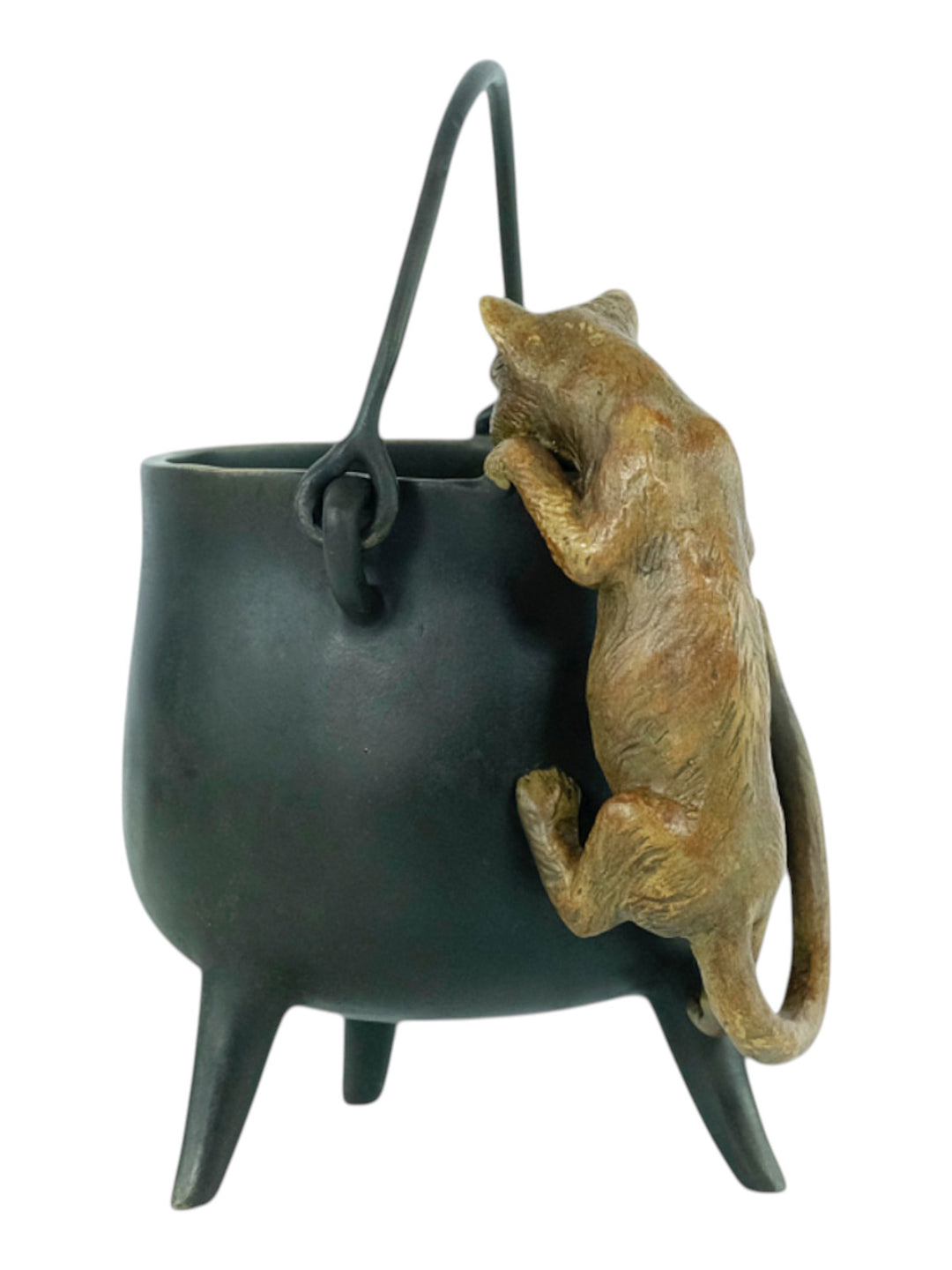 Bronze sculpture of a curious cat climbing into a cauldron