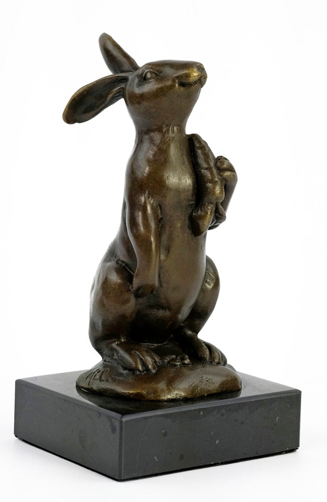 Bronze sculpture of a bunny holding a carrot