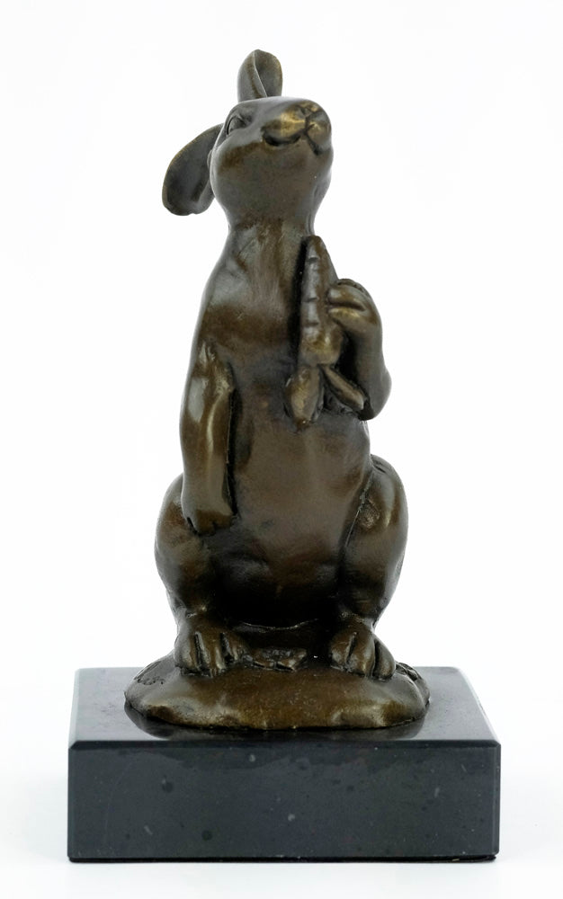 Bronze sculpture of a bunny holding a carrot