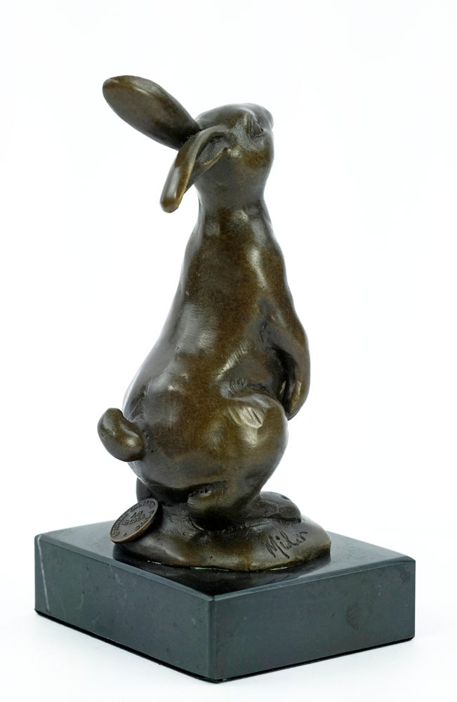 Bronze sculpture of a bunny holding a carrot
