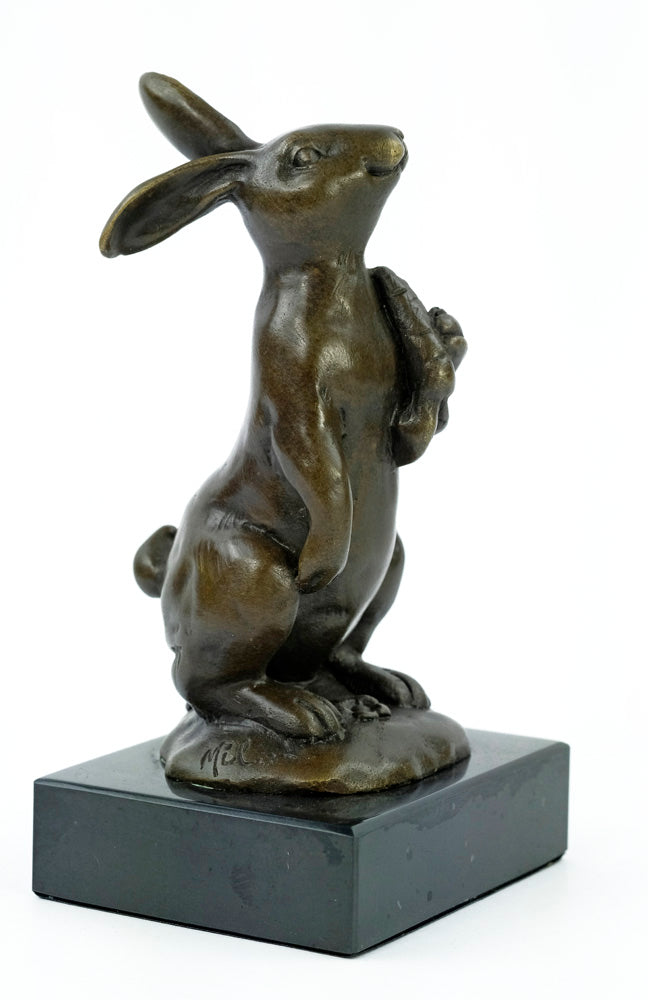 Bronze sculpture of a bunny holding a carrot
