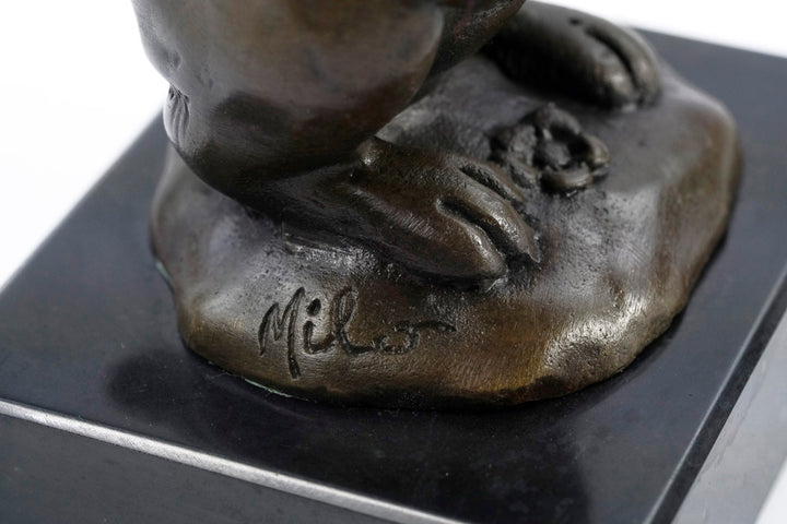 Bronze sculpture of a bunny holding a carrot