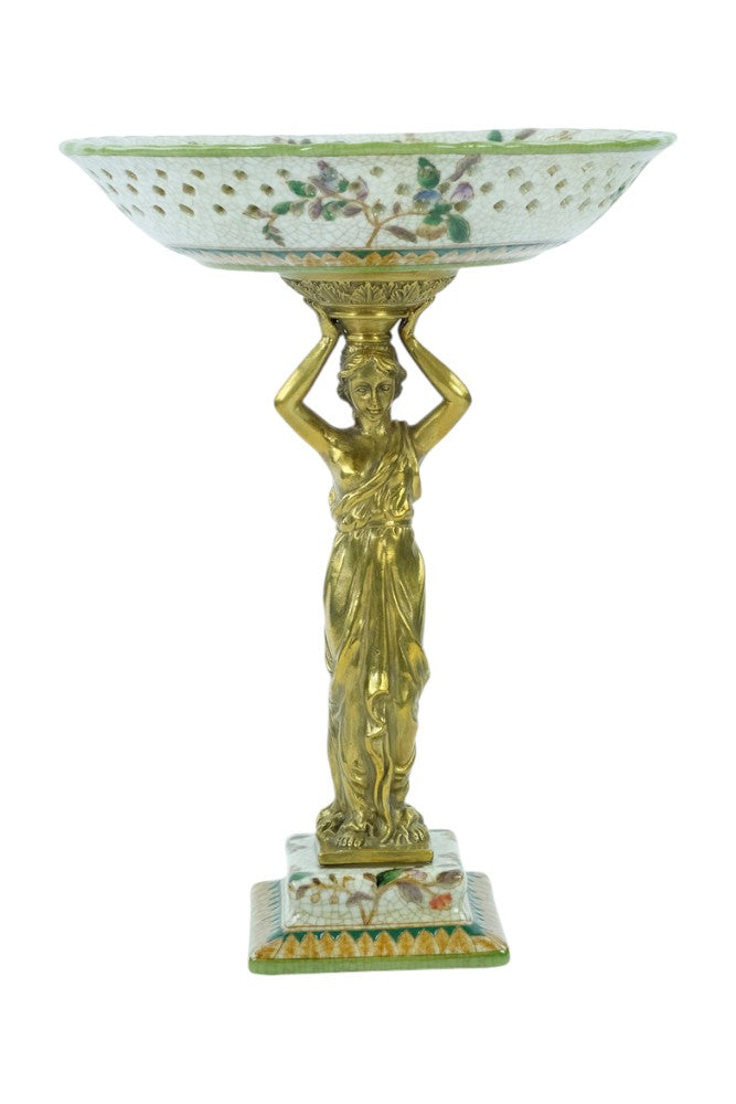 Porcelain bowl carried by a bronze female
