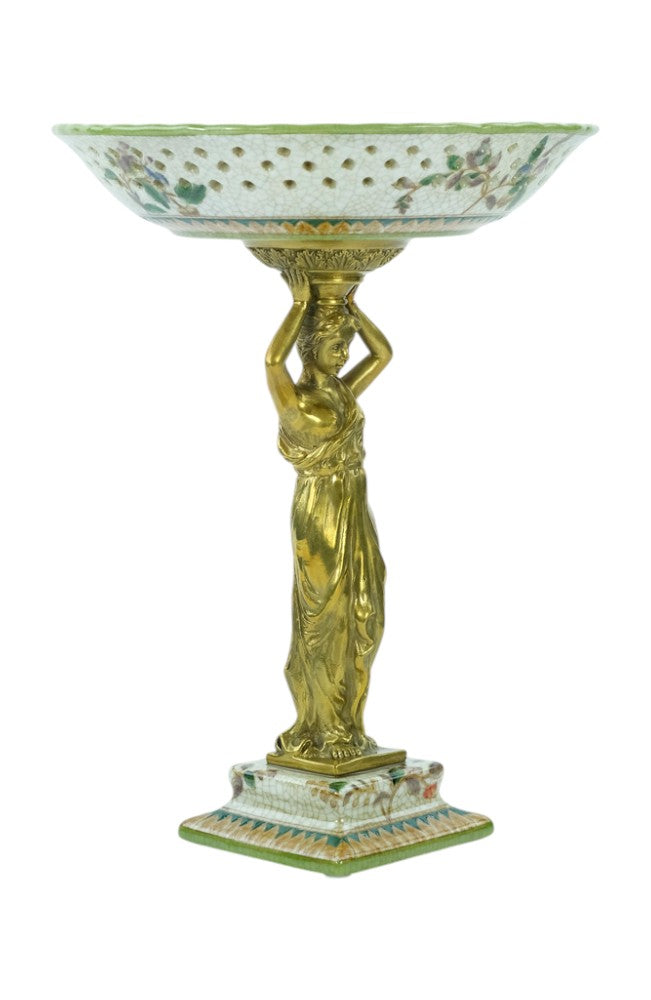 Porcelain bowl carried by a bronze female
