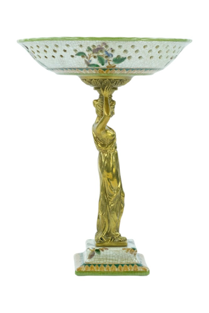 Porcelain bowl carried by a bronze female