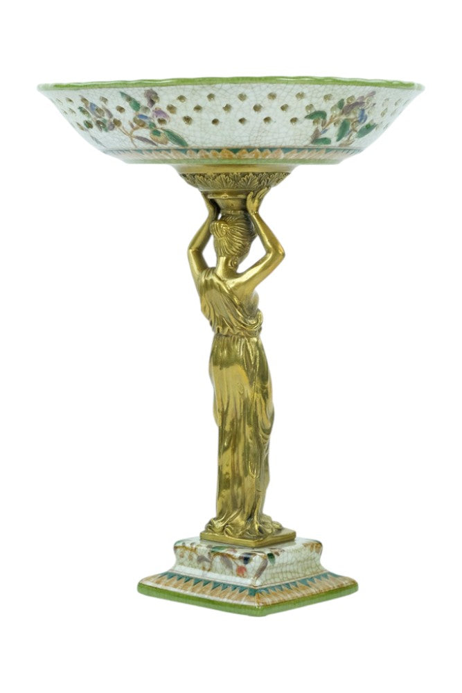 Porcelain bowl carried by a bronze female
