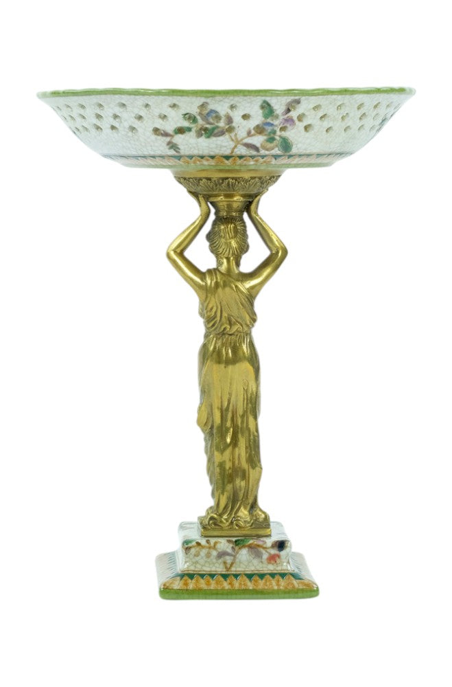 Porcelain bowl carried by a bronze female
