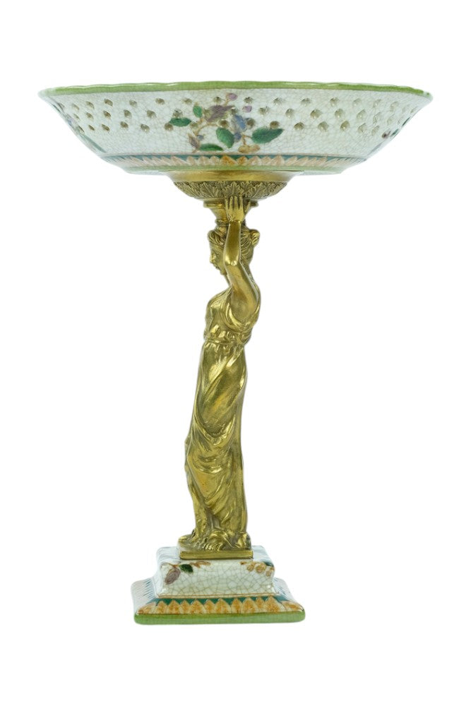 Porcelain bowl carried by a bronze female