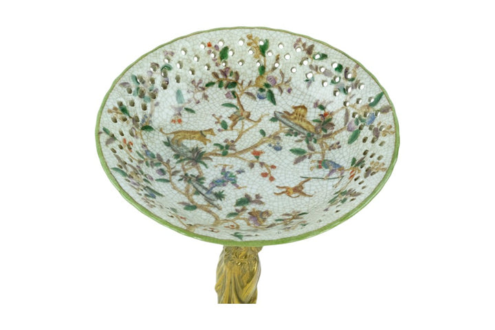 Porcelain bowl carried by a bronze female