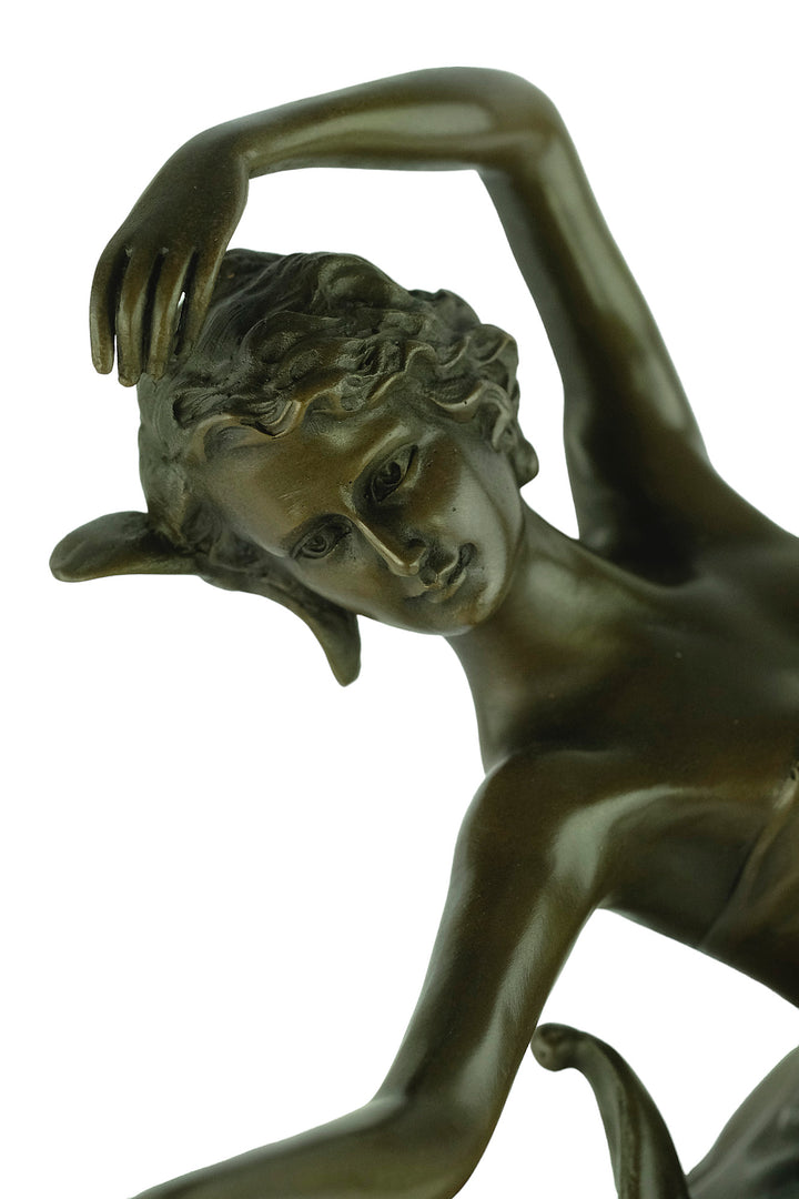 Bronze sculpture of a female dancer in a flowy dress