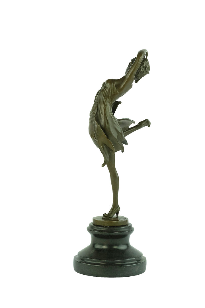 Bronze sculpture of a female dancer in a flowy dress