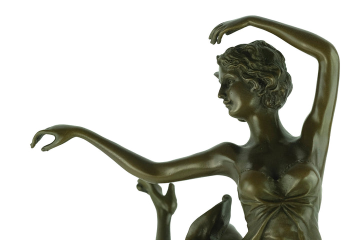 Bronze sculpture of a female dancer in a flowy dress