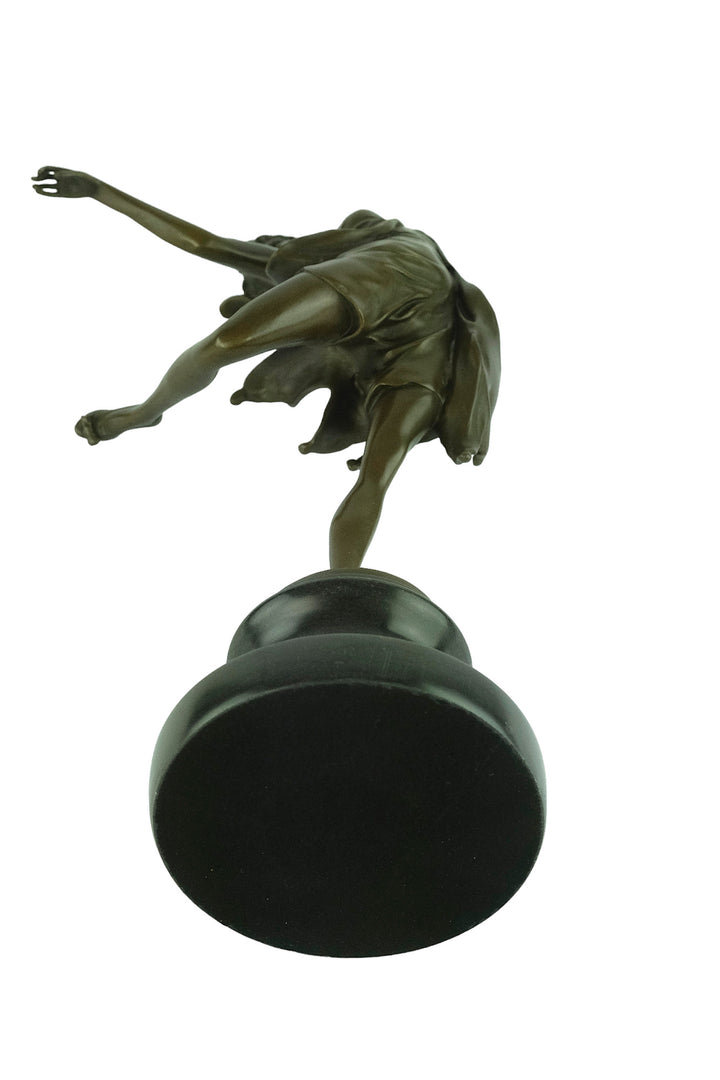 Bronze sculpture of a female dancer in a flowy dress