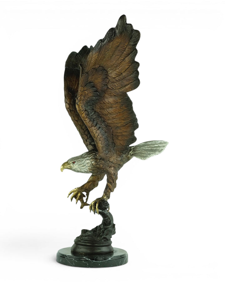 Bronze sculpture of a fishing eagle with wings spread