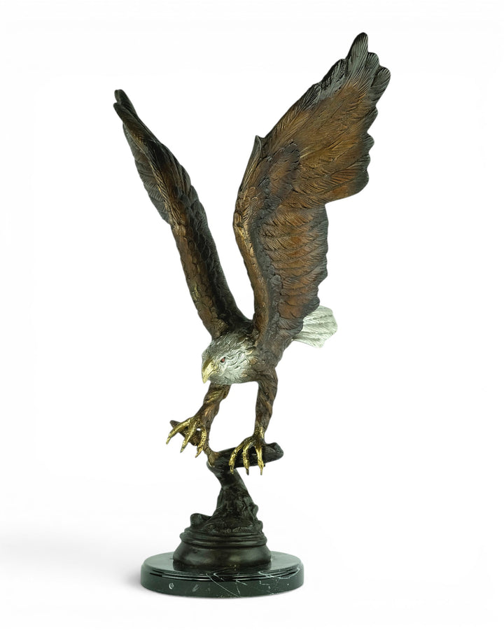 Bronze sculpture of a fishing eagle with wings spread